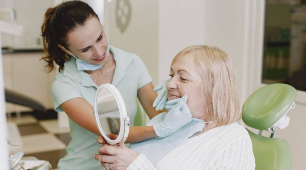 Elderly woman having dental implants for seniors at City Dental Hospital. 