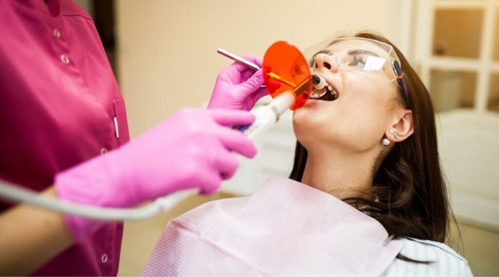 Dentist Examining a patient for full mouth rehabilitation treatment and also explaining the details of the full mouth rehabilitation cost in India