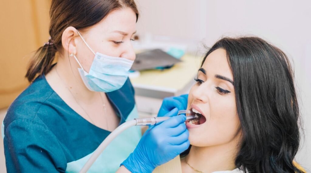 Dentist Examining a patient for full mouth rehabilitation treatment and also explaining the details of the full mouth rehabilitation cost in India