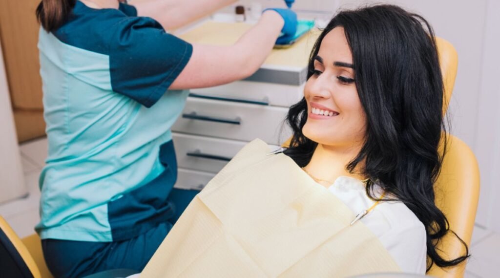 Female patient waiting for dentist in office at City Dental Hospital after successful smile makeover treatment